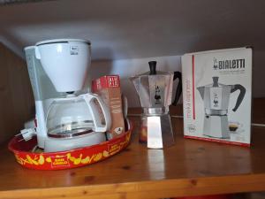 a blender sitting on a table next to a box at Loft Apartman in Krk