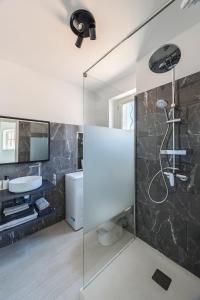 a bathroom with a shower and a sink at Le plaisir des yeux ! in Cassis +11 photos