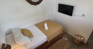 Postel nebo postele na pokoji v ubytování Mandala Hostel Jeri