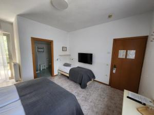 TV a/nebo společenská místnost v ubytování Casa Beniamino