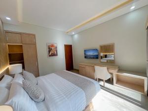 Postel nebo postele na pokoji v ubytování Jonsen Homestay