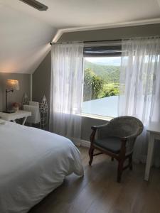 Ένα ή περισσότερα κρεβάτια σε δωμάτιο στο Omi`s Place of Stay