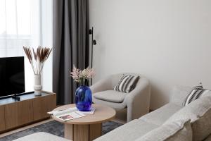 a living room with a couch and a chair at Bob W Tallinn Kesklinn in Tallinn
