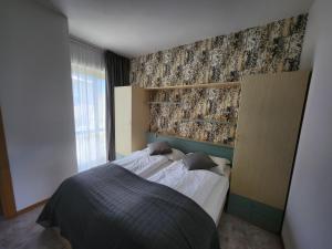 Letto o letti in una camera di Casa Beniamino