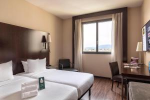 Postel nebo postele na pokoji v ubytování B&B Hotel Arezzo
