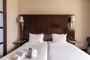 Postel nebo postele na pokoji v ubytování B&B Hotel Arezzo