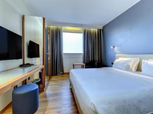 Ένα ή περισσότερα κρεβάτια σε δωμάτιο στο B&B Hotel Quarto d'Altino