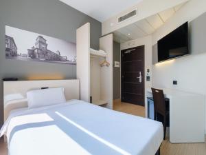 Postel nebo postele na pokoji v ubytování B&B Hotel Ferrara + 19 fotografií