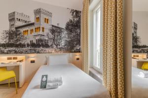 Postel nebo postele na pokoji v ubytování B&B Hotel Treviso