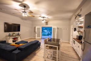 a living room with a couch and a table at Lake Travis Lakefront Retreat - Hot tub - Boat Ramp - Lakeside Parks in Lago Vista