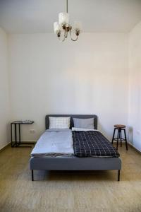 Postel nebo postele na pokoji v ubytování Parókia apartman és coworking a Balaton mellett