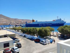 a large ship is docked in a parking lot at Triton Villa at Kasonia beach Pothia in Kalymnos