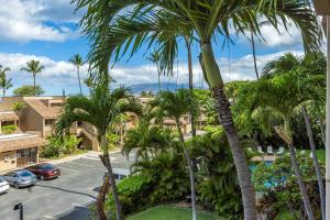 a view of a street with palm trees at Kamaole Beach Royale 208 in Kihei