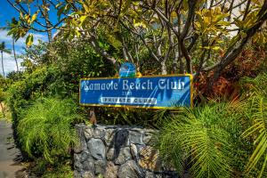 a blue sign for the entrance to a beach club at Kamaole Beach Royale 208 in Kihei