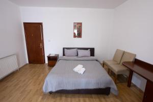 Voodi või voodid majutusasutuse Garni Hotel Palma toas