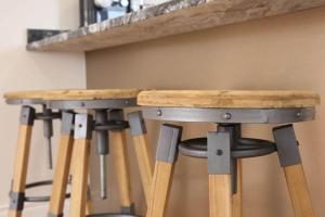 a couple of bar stools under a counter at Luxury Pet-Friendly Retreat with Private Hot Tub in Boardmills