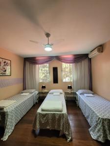 Postel nebo postele na pokoji v ubytování Kzazendf Cama&Cafe Hospedagem Familiar