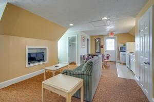 a living room with a couch and a table at Ocean Lodge Hotel South in Ocean City