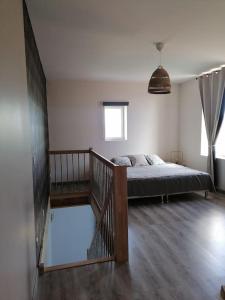 En eller flere senge i et værelse på Duplex neuf avec extérieur