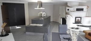 a living room with a couch and a table in a room at Ferienwohnung Alina in Bad Berleburg