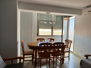 a dining room with a table and chairs at Prado in Peniscola