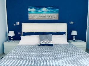 A bed or beds in a room at Casa Limoni al mare tra Catania Etna e Taormina