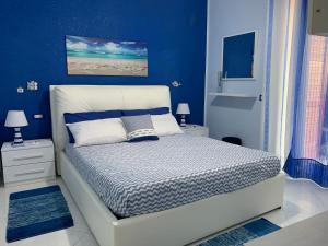 A bed or beds in a room at Casa Limoni al mare tra Catania Etna e Taormina
