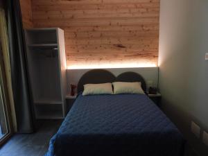 Postel nebo postele na pokoji v ubytování Albergo Rusen
