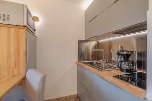 Η κουζίνα ή μικρή κουζίνα στο Studio 4 personnes ensoleillé et proche de tout