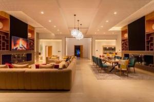 a large living room with a couch and a table at Villa des stars in Marrakesh