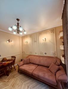 a living room with a couch and a table at Piacere in Gonio in Kvariati