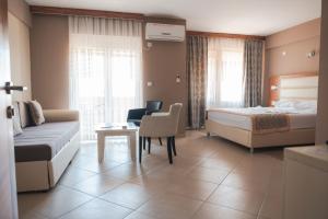 Postel nebo postele na pokoji v ubytování Emerald Hotel + 33 fotografií