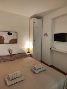 Postel nebo postele na pokoji v ubytování Assi Room