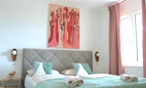 Ein Bett oder Betten in einem Zimmer der Unterkunft Traunseeresidenzen