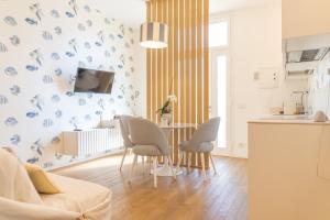 a kitchen with a table and chairs in a room at About Italy Holiday Rooms and Apartments in Portovenere
