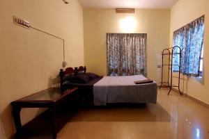 Postel nebo postele na pokoji v ubytování Happy Buddha Homestay