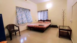 Postel nebo postele na pokoji v ubytování Happy Buddha Homestay