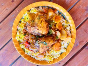 a plate of food with meat and vegetables on a table at אוהל בוסתן הזיתים in Midreshet Ben Gurion +22 photos