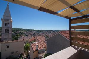 a view from a balcony of a church with a tower at Castello in Mali Lošinj