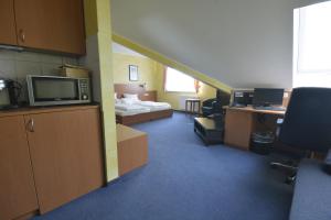 Postel nebo postele na pokoji v ubytování Hotel Nord
