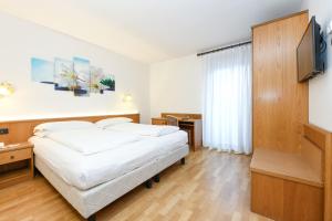 Łóżko lub łóżka w pokoju w obiekcie Hotel Denny