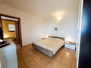 Giường trong phòng chung tại Stella del Coghinas +8 ảnh