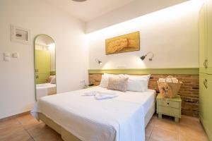Postelja oz. postelje v sobi nastanitve Saronis Hotel Agistri - Adults Only