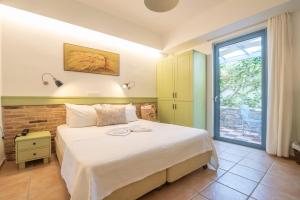Postelja oz. postelje v sobi nastanitve Saronis Hotel Agistri - Adults Only