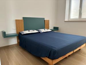 Giường trong phòng chung tại Spirito Santo