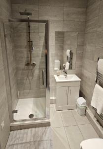 a bathroom with a shower and a sink at 8 Water Street in Liverpool
