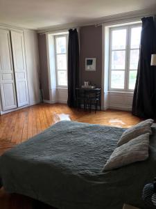 Postel nebo postele na pokoji v ubytování La maison de Mathilde