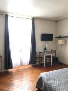 Postel nebo postele na pokoji v ubytování La maison de Mathilde