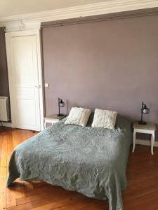 Postel nebo postele na pokoji v ubytování La maison de Mathilde