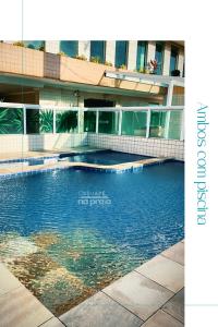 Πισίνα στο ή κοντά στο Apartamento Com Piscina e Sacada Gourmet- Aviação#